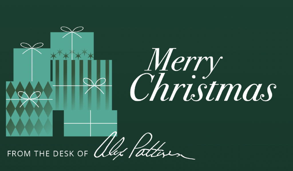 Green holiday card with teal gift boxes left and 'Merry Christmas' in white script on the right; 'From the desk of' and a signature at the bottom.