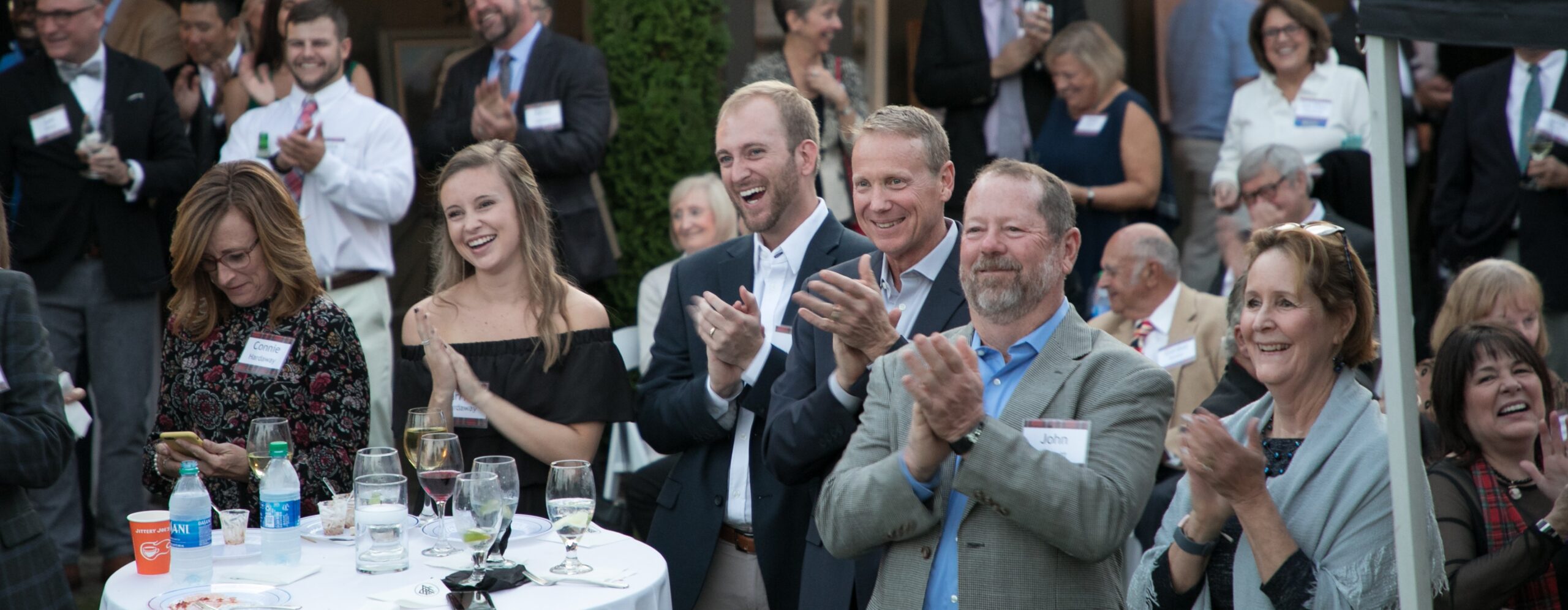 Several men and women enjoy the Caring Hands gala and golf tournament.