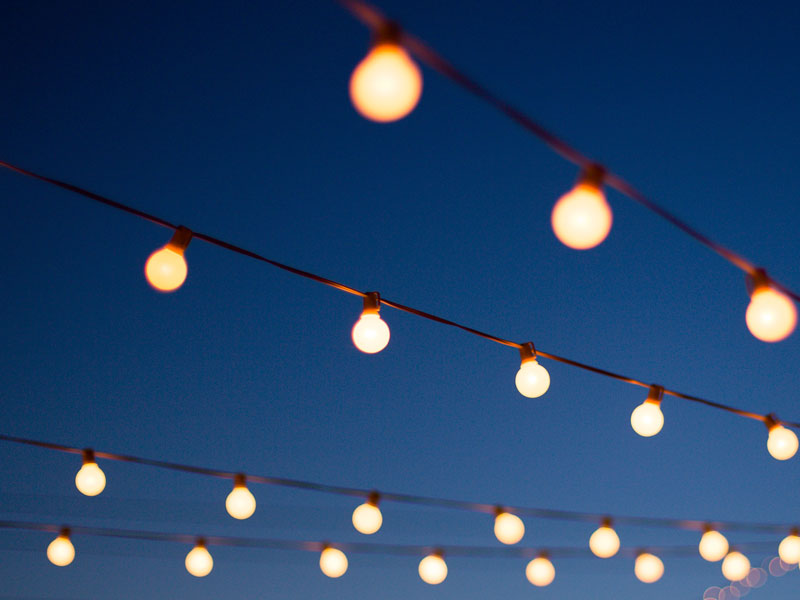 String lights with classic large bulbs at dusk